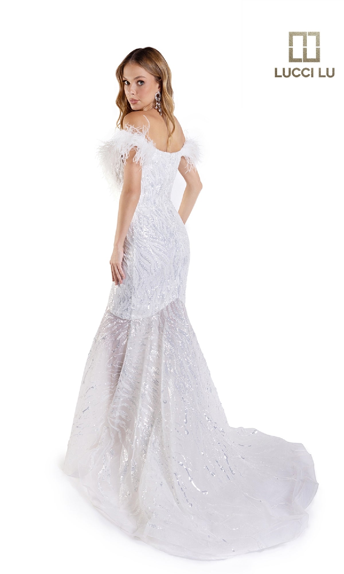 A woman faces back in the Lucci Lu C8051 Beaded Tulle White Wedding Dress, featuring an off-the-shoulder feathered neckline, sequin mermaid silhouette, long flowing train, and feathered sleeves. Lucci Lu logo appears in the top right.